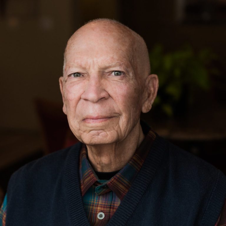 Portrait of an elderly man with a calm expression.