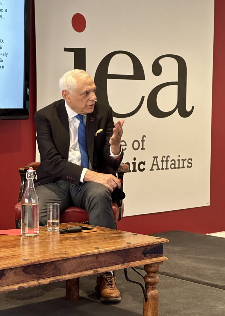 A man speaking at an Institute of Economic Affairs event.