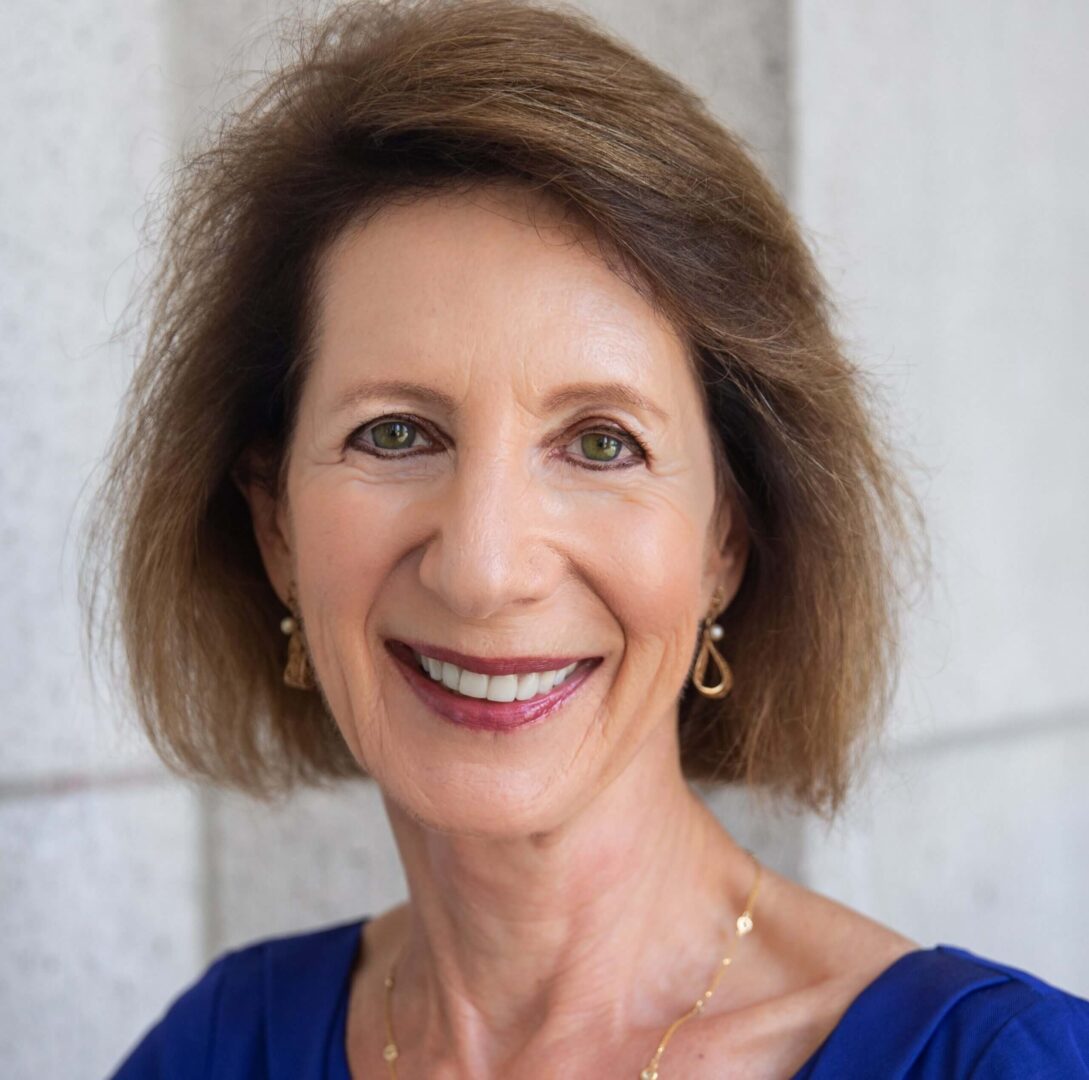 Smiling woman close-up portrait, blue top